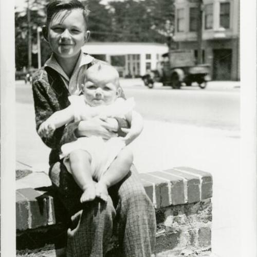 [Sandra at seven months old with brother Bob on 7th Avenue in 1937]