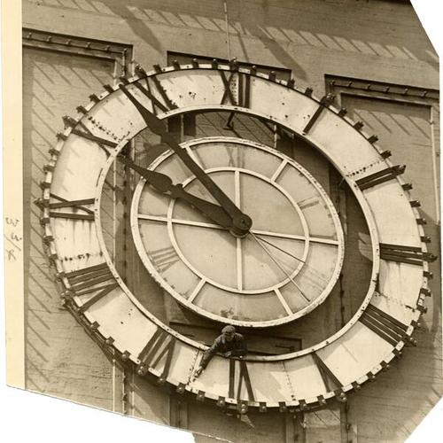 [Unidentified maintenance worker on Ferry Building clock]