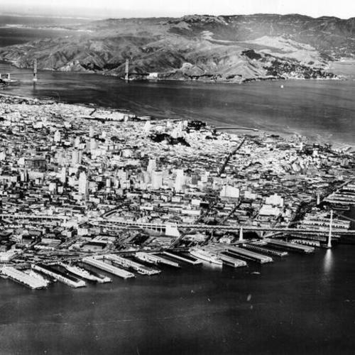 [Aerial view of San Francisco including the Golden Gate Bridge and the Bay Bridge]