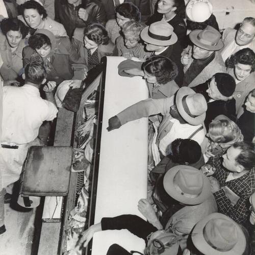 [Customers purchasing New Zealand beef from a meat counter at the Crystal Palace Market]