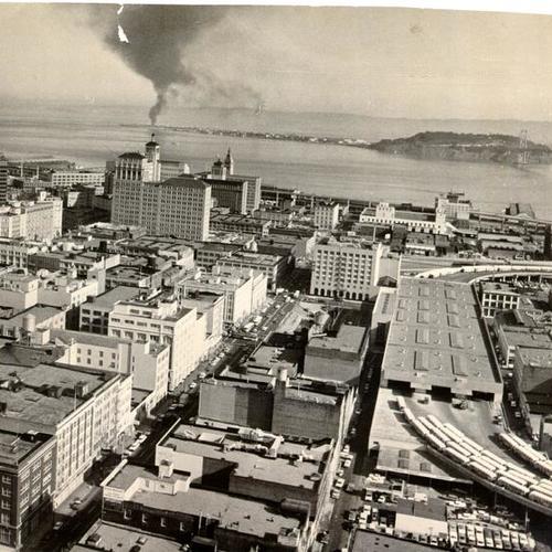 [View of downtown San Francisco, looking east, with Treasure Island and Yerba Buena Island in distance]