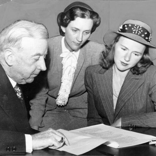 [Thomas A. Brooks, the city's chief administrative officer, explains municipal operations to Mrs. Rodney Beard and Mrs Richard S. Cahn of the League of Women Voters]