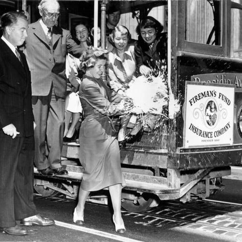 [Cable car being christened "The Fireman's Fund" during a ceremony held at California and Sansome streets]
