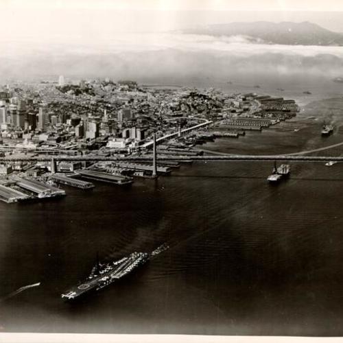 [Aircraft carrier USS Midway leading the First Fleet into San Francisco Bay]