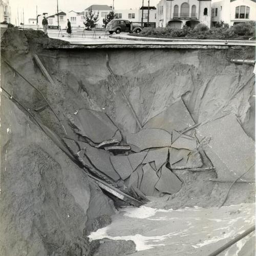 [Massive cave-in at 34th Avenue and Wawona Street caused by heavy rain]