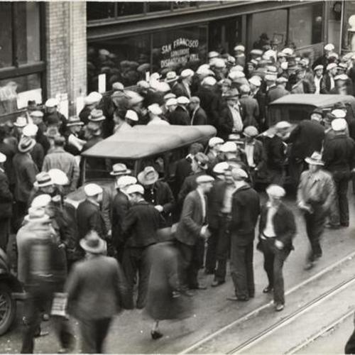 [Crowd of longshoremen standing in front of dispatching hall]