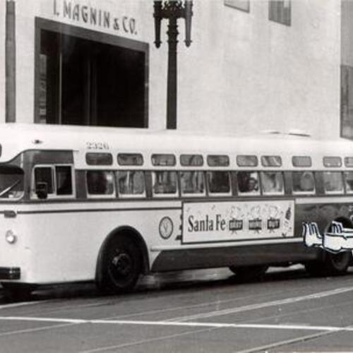 [38 Geary bus making a stop in front of I. Magnin & Company store on Geary Street]