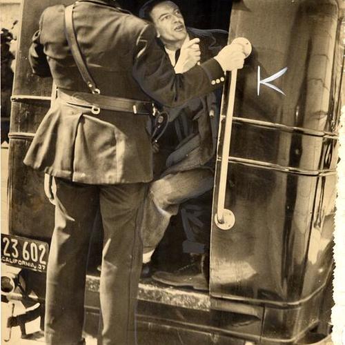[Police arresting disturber during the 1937 WPA strike]