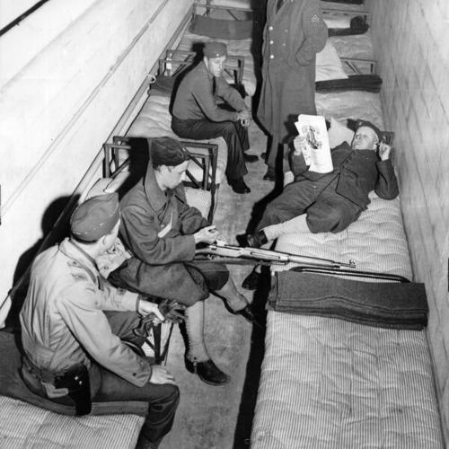 [State guardsmen for Golden Gate Bridge during World War II resting in barrack]