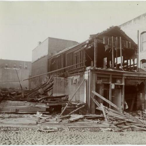 057 Demolition of wooden buildings in progress