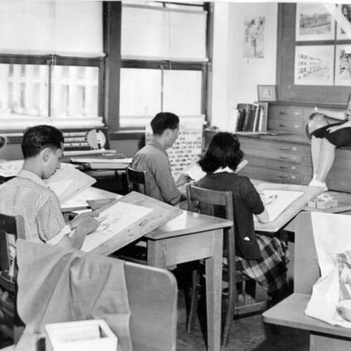 [Students sketching from live model in class at George Washington High]