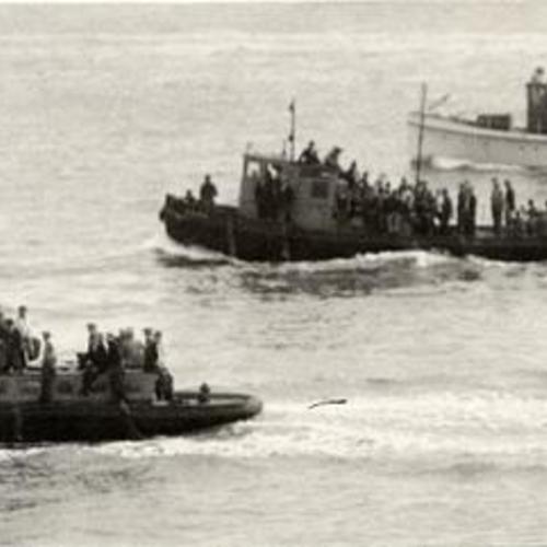 [Strikebreakers being transported on boats during longshoremen's strike]