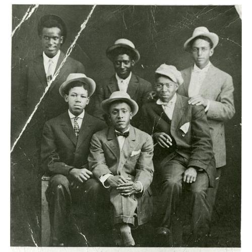 [Alonzo, second from left, with his brother's, Charles and Edward plus friends]