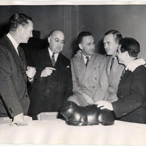 [Beniamino Bufano (far right) showing one of his pieces during a conference at the Press Club in San Francisco]