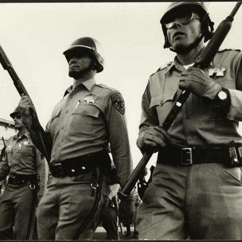 [California Highway Patrol in riot gear during the 1966 Bayview-Hunters Point riots]
