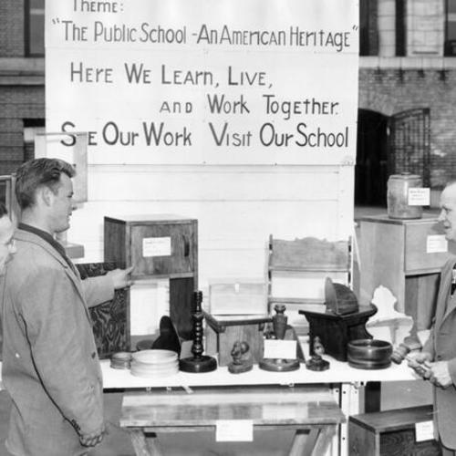 [Principal Carl Bash, shop instructor Henry Duff Jr. and host Bruce Owens at an exhibition at Continuation High School]