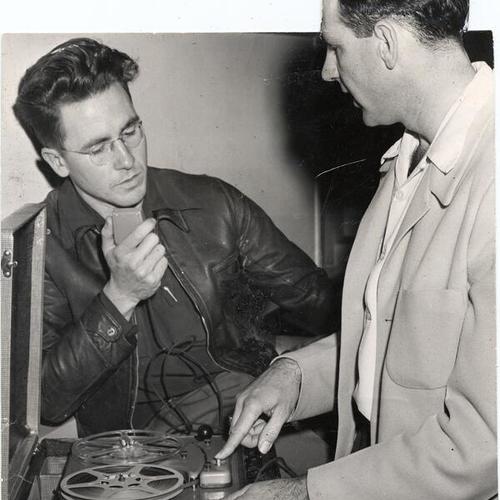 [Instructor Elmo Kerchief demonstrating the use of a tape recorder to student Frank Power at San Francisco State College]