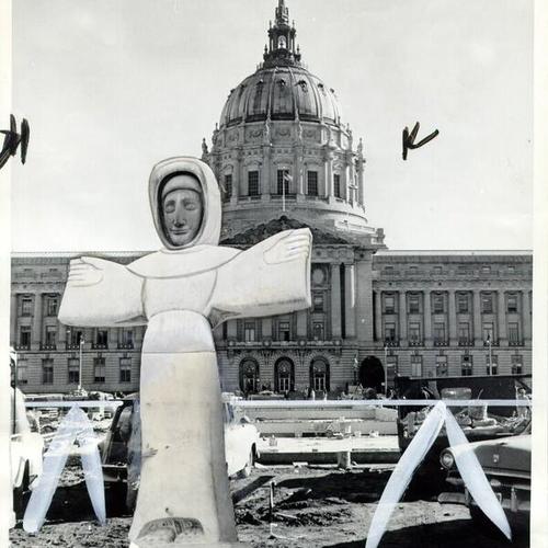 [Superimposed image of St. Francis on a photograph of the Civic Center Plaza during restoration]