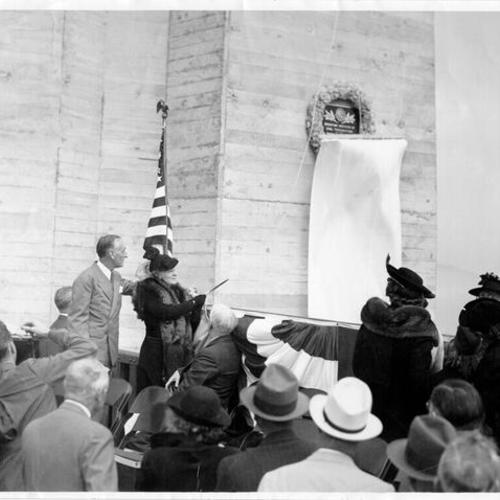 [Mrs. Joseph B. Strauss and F. H. Frankland unveil plaque at Golden Gate Bridge ceremony]