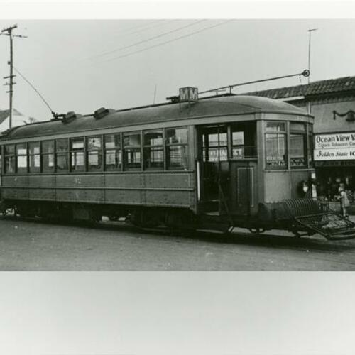 [M Line and original Muni car #42 built in 1912 at end of line]
