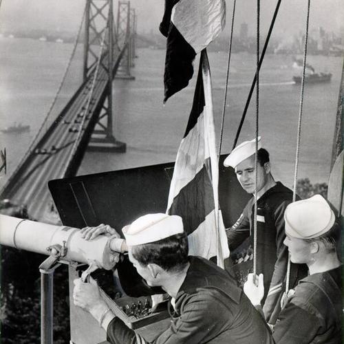 [Crew at the Navy's lookout and signal station on Yerba Buena Island signaling a ship anchored in the bay]