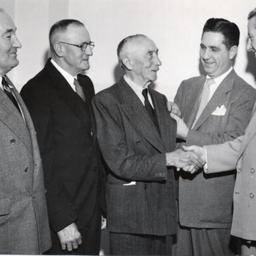 [Union officials at a 50th anniversary celebration for A. F. L. Teamsters Local 85]