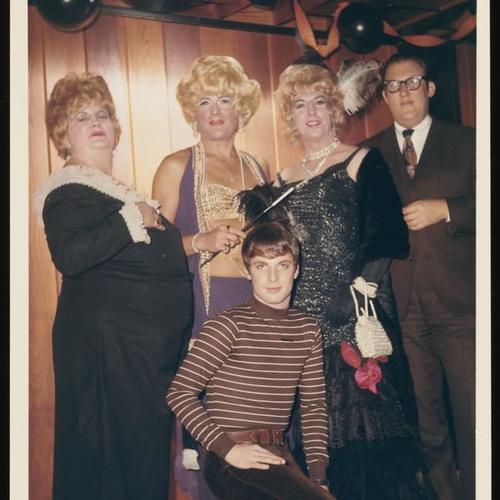 Portrait of five people on stage at Halloween party