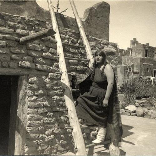 [Pueblo Indian woman in Grand Canyon of Arizona exhibit in The Zone at the Panama-Pacific International Exposition]