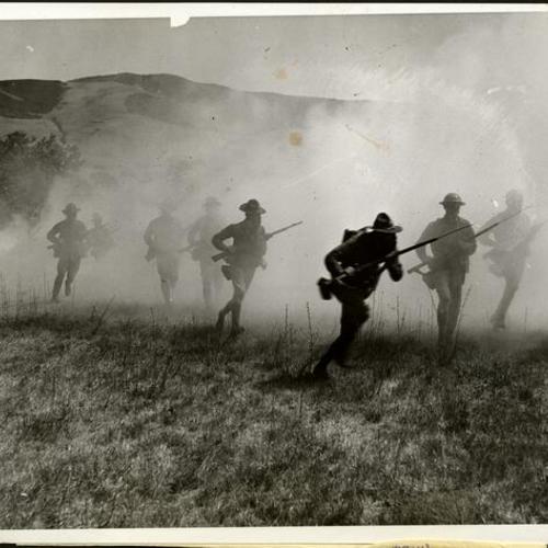 [Platoon of the 160th Infantry charging through a smoke screen in battle practice during war games staged near San Luis Obispo, California]