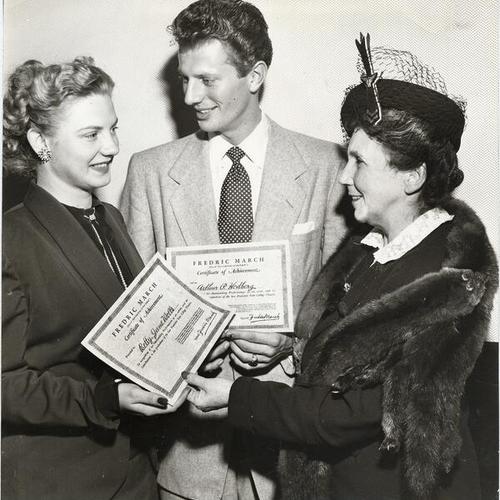 [San Francisco State College drama students Betty Jane Wells and Arthur P. Hedberg receiving awards from Hulda McMinn of the California Theatres Association]