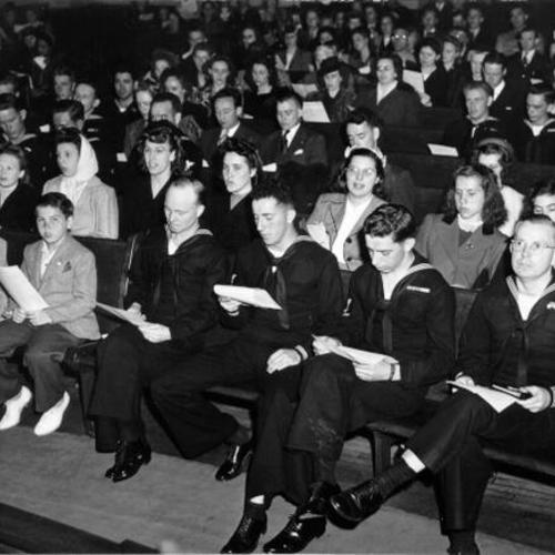[Sailors and civilian youth at a youth revival at Glide Memorial Church]