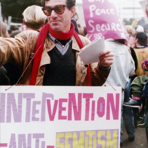 [Mark carrying a sign at a peace march in response to the first Iraq invasion]