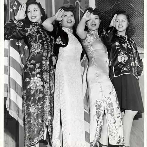 [Female entertainers saluting to a crowd of service men in Chinatown]