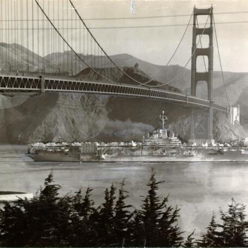 [Aircraft carrier Ticonderoga passing underneath the Golden Gate Bridge]