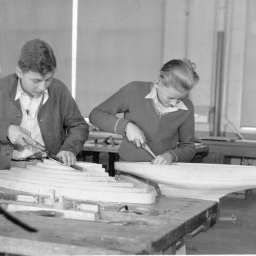 [Two students in a wood shop at Portola Junior High School]