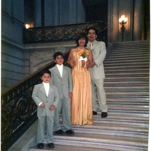 [Juan Carlos, wife and step children on City Hall Rotunda steps]