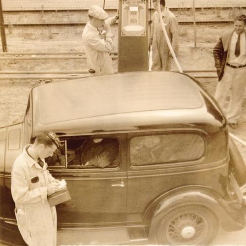 [Motorist filling gas at Union 76 gas station during strike of 1934]