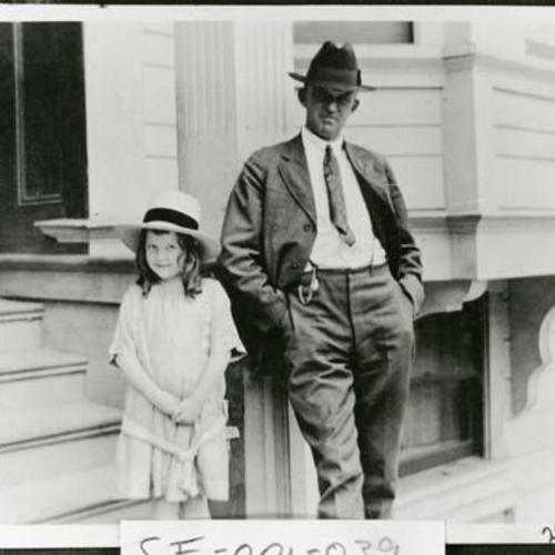 [Lorraine standing next to her father, George, on Eddy Street in 1920]