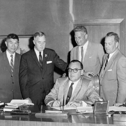 [Governor Edmund G. Brown signs the bill permitting the floricultural and nursery industry to come under the State's Marketing Act]