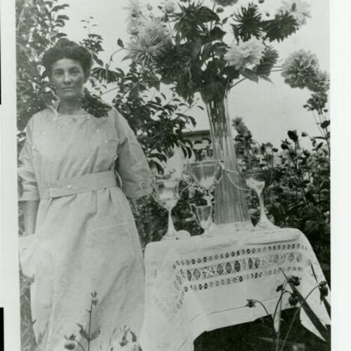[Judith's grandmother, Mary Ellen, in her backyard at Broad Street with her prize winning dahlias]