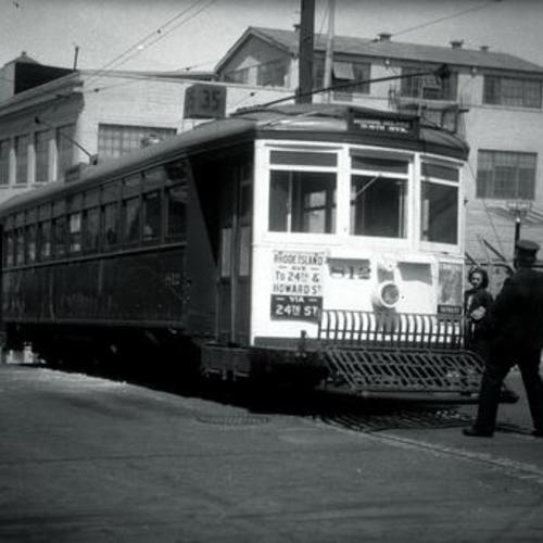 [24th and Rhode Island streets looking northwest at motorman pulling trolley pole on #35 car 812]