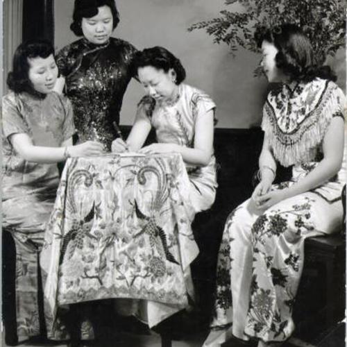 [Virginia Wong, Helen Jow, Sybil Chin and Catherine Chu making plans for the spring fashion show]