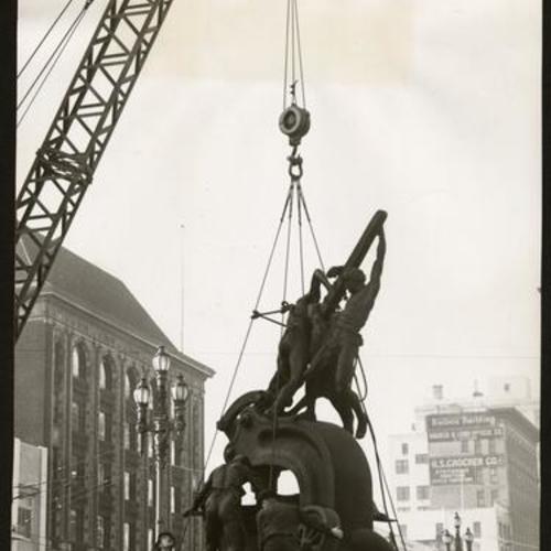 [Workers moving the Donahue Monument, also known as the Mechanics Monument, 40 feet from its original location at Battery and Market Streets]