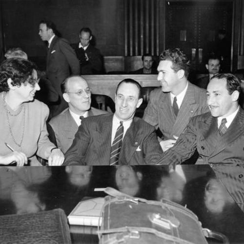 [Harry Bridges flanked by his attorneys]