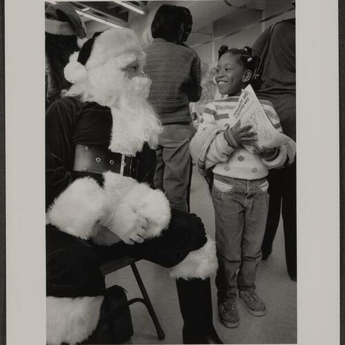 Child meets Santa Claus at Boeddeker Park Christmas party