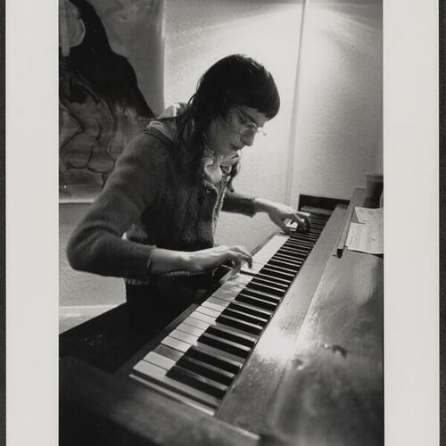 Tenderloin composer Jennifer Diane playing piano at 509 Cultural Center