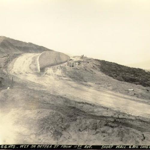 [Golden Gate Heights - westerly on Ortega Street from 11th Avenue, short wall and beginning of long wall]