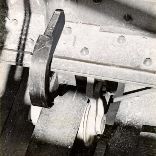 [Closeup of equipment similar to that which broke causing an accident in which ten construction workers on the Golden Gate Bridge were killed]