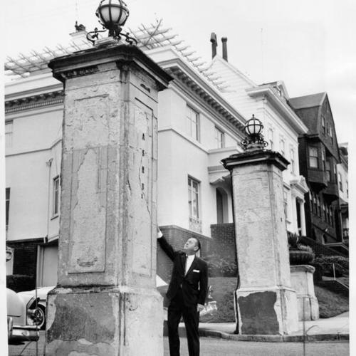 [Martin O'Dea standing before a large crumbling pillar located at Piedmont at Ashbury street known as Ashbury Terrace]