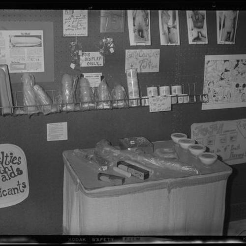 Interior view of peg board display of "novelties, health aids and lubricants"